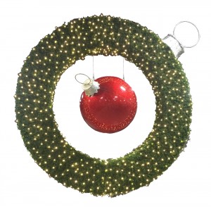 giant sierra pine wreath with ball ornament suspended in middle