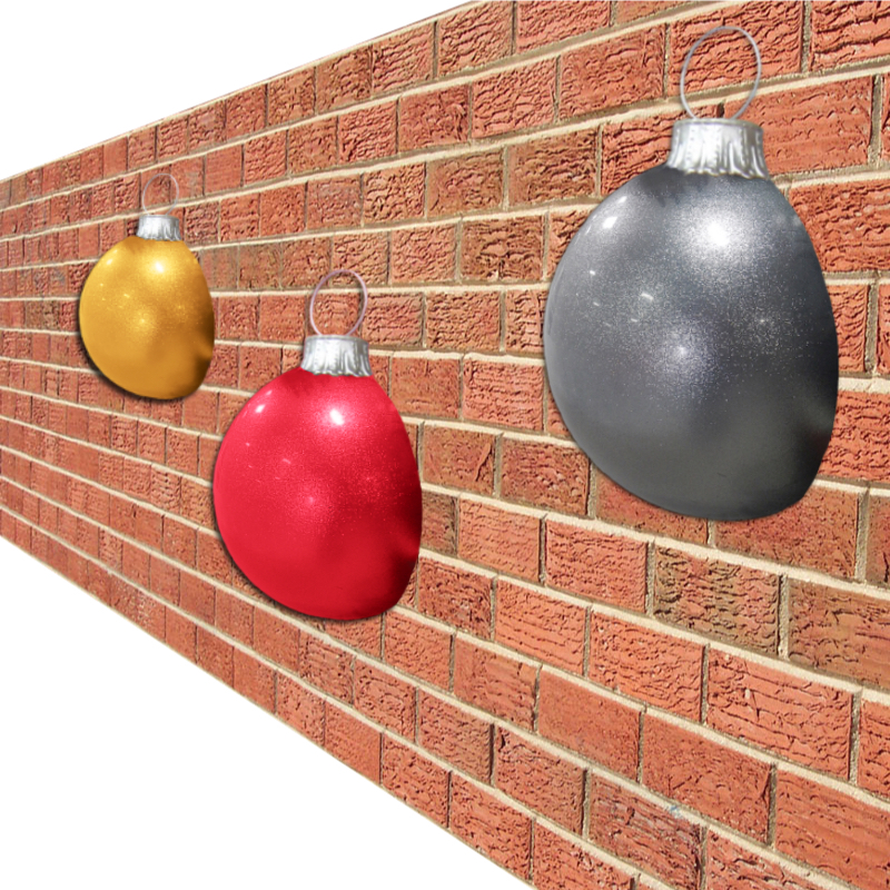 giant HALF balls hanging on brick wall
