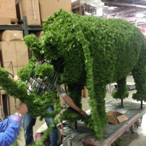 rhinoceros topiary animal greenery being applied