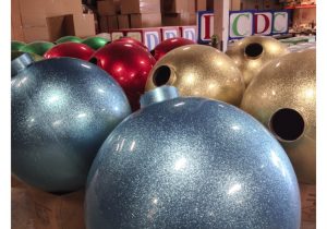 giant glitter ball ornaments for Christmas in production at the Barrango factory South San Francisco, CA