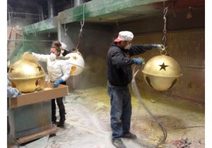 Production in the Barrango Factory gold glittering of giant jingle bells