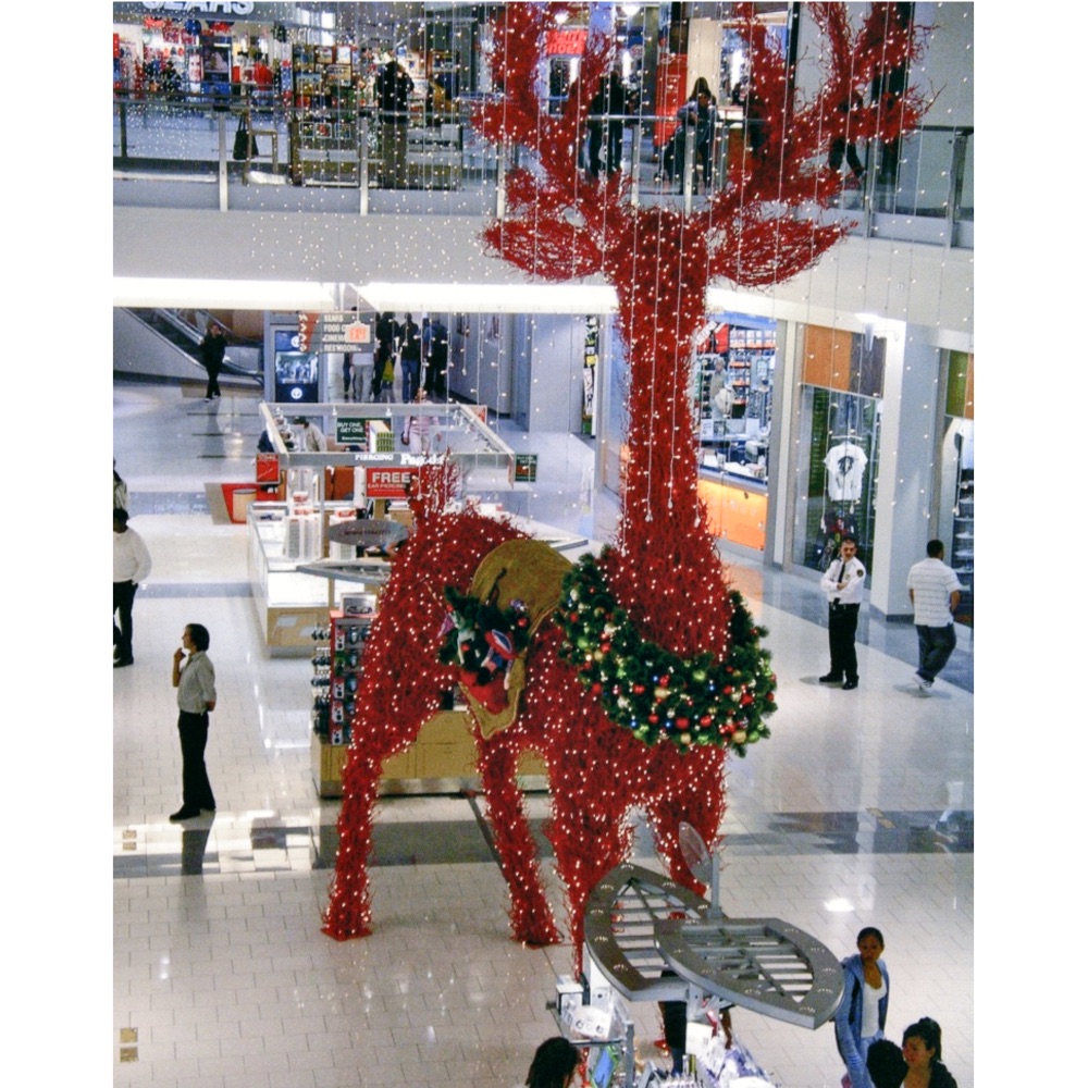 giant-manzanita-reindeer-in-shopping-mall Giant Red Manzanita Reindeer standing in Shopping Mall 2 floors tall